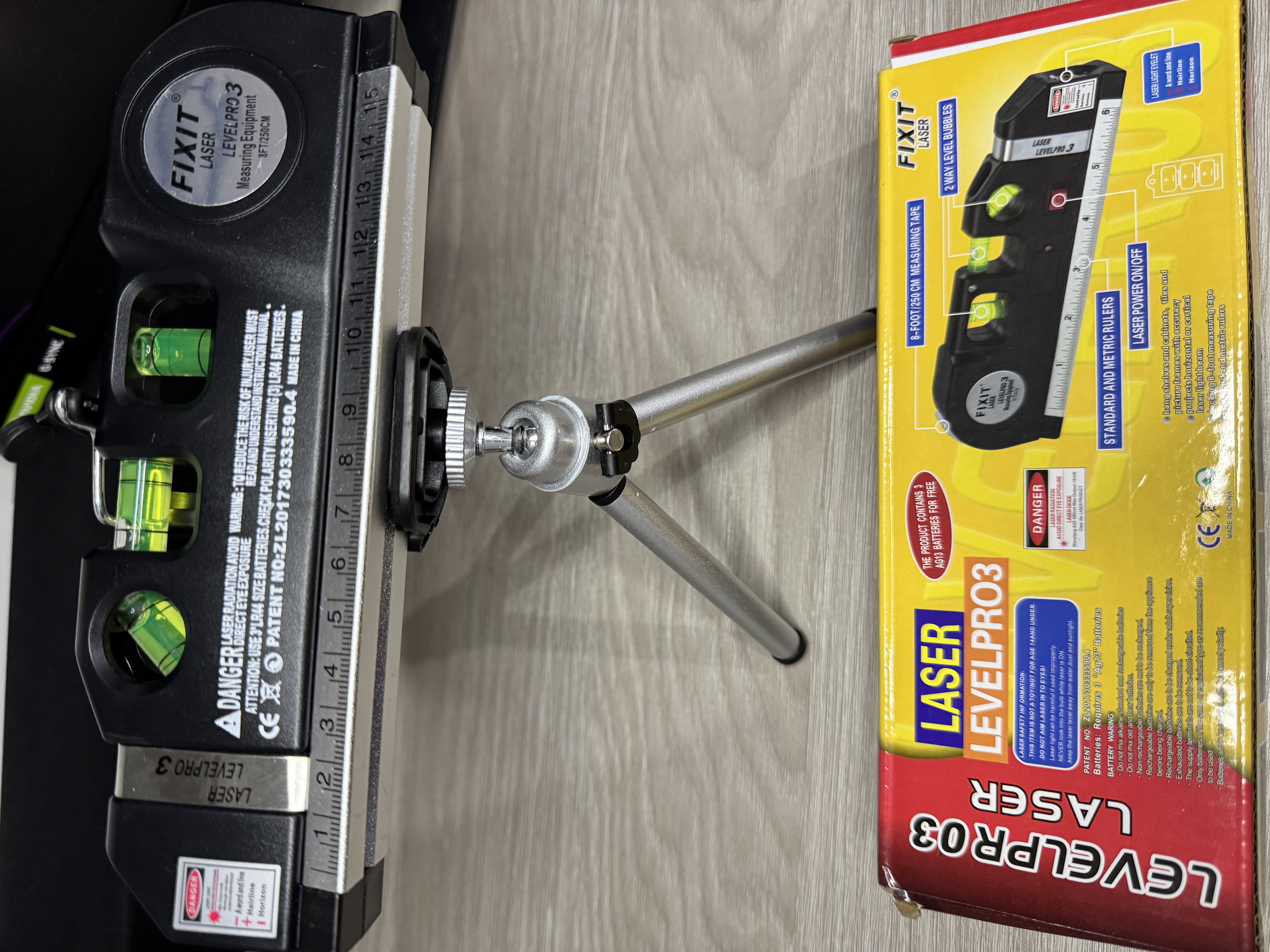 Nivel laser trípode y afilador brocas