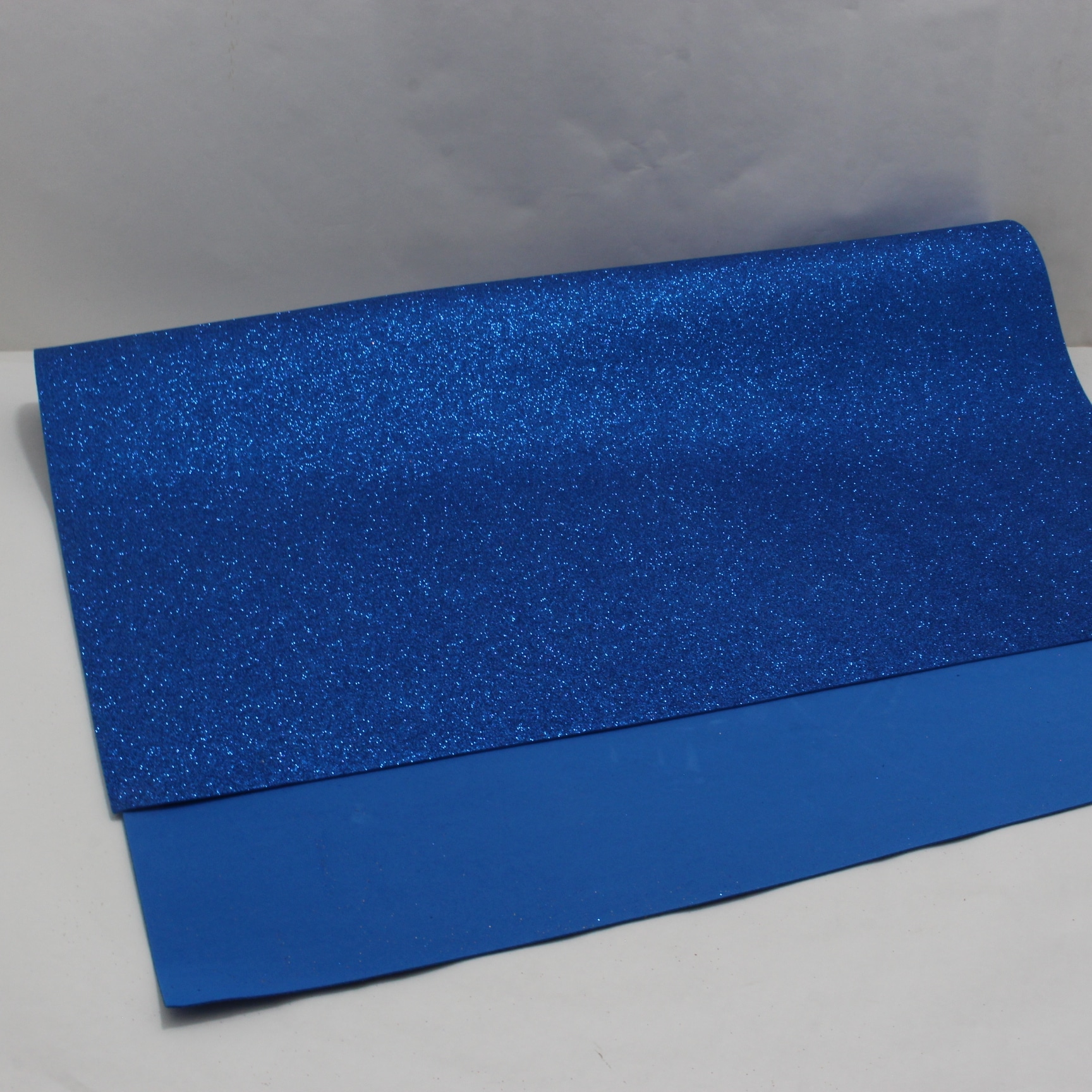 PLIEGO FOMMY ESCARCHADO AZUL REY 70X100